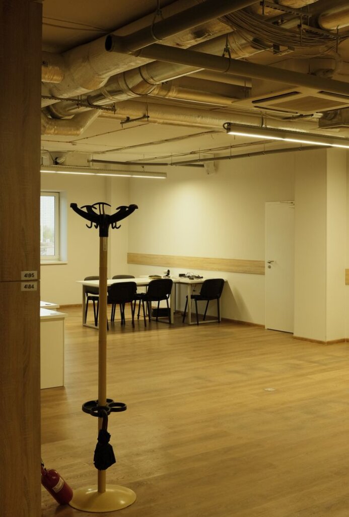 Bright, spacious office interior with wooden floors and modern furnishings in Kyiv, Ukraine.